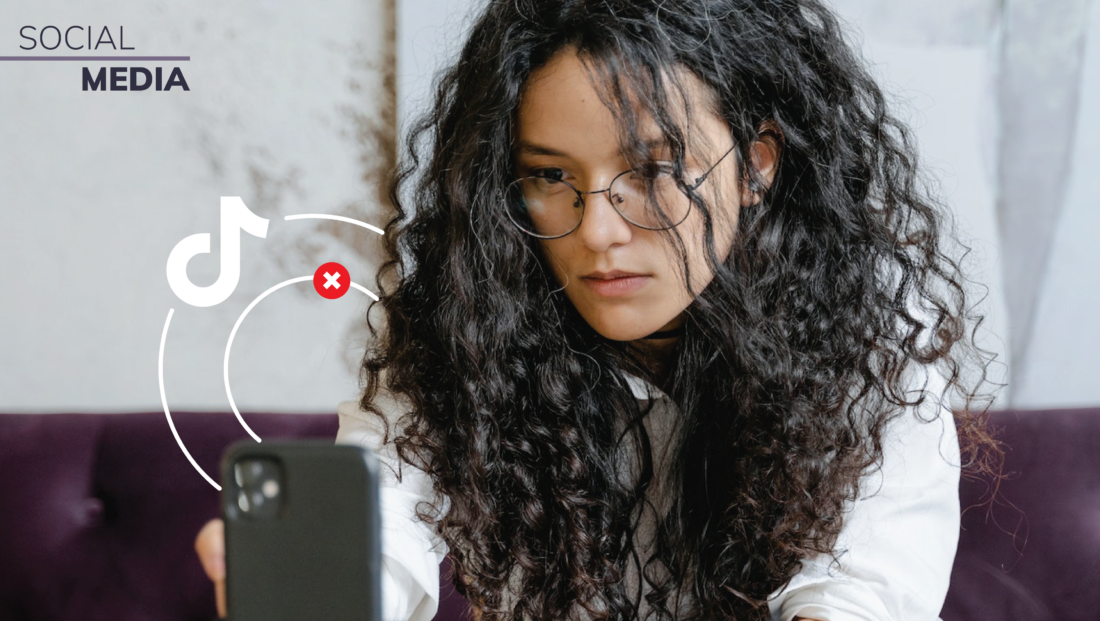 Header image of a woman looking intently at her phone with the TikTok logo featured on the side.