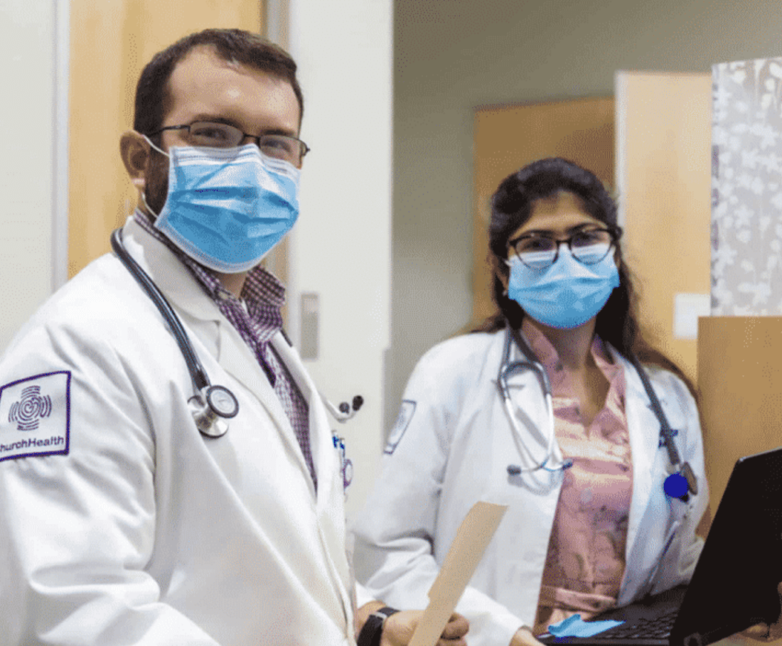 Image of two doctors form church health with masks on