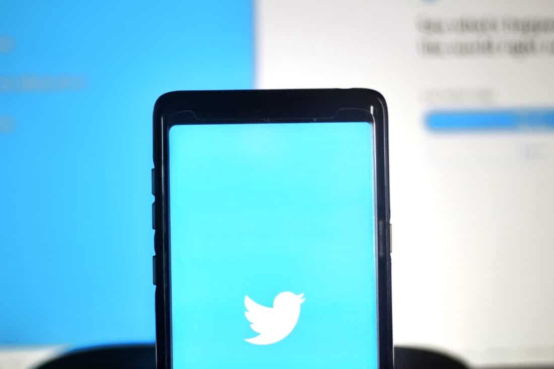 phone with twitter logo on screen