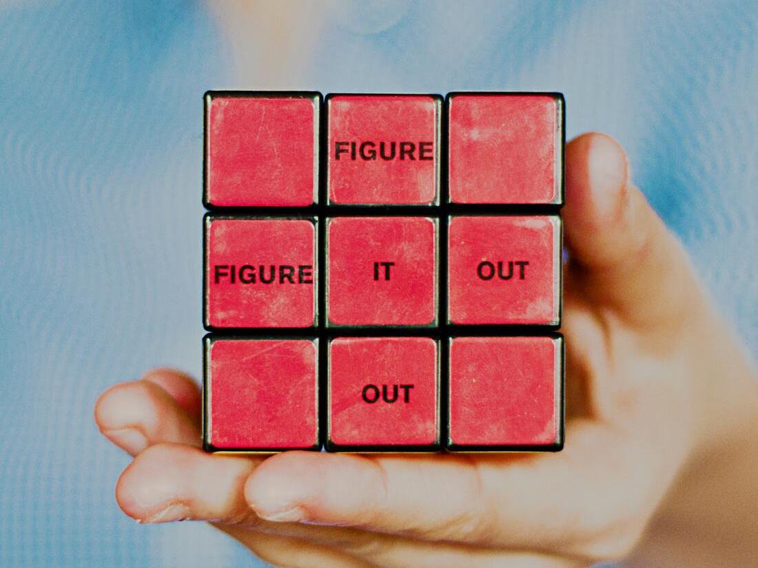 rubix cube with "Figure it out" on it