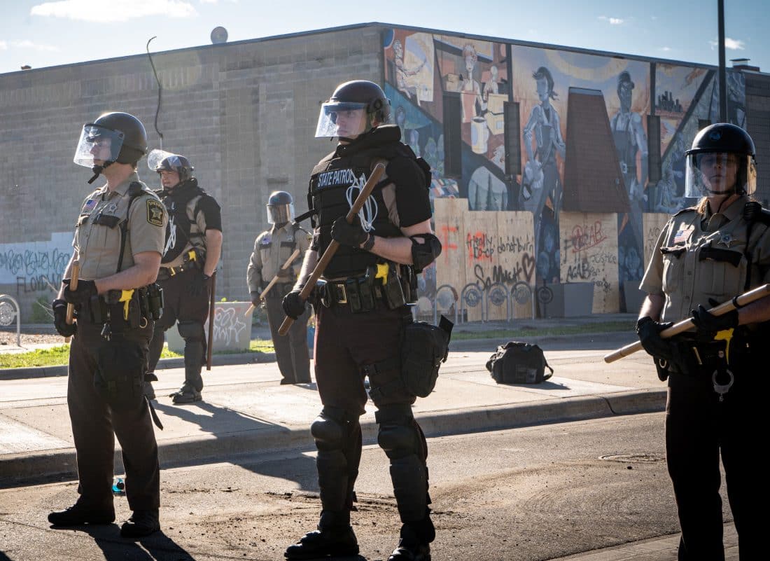 image of police officers in riot gear