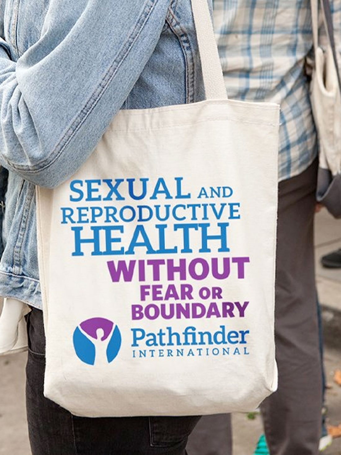 Pathfinder International tote bag that says "Sexual and reproductive health without fear or boundary."