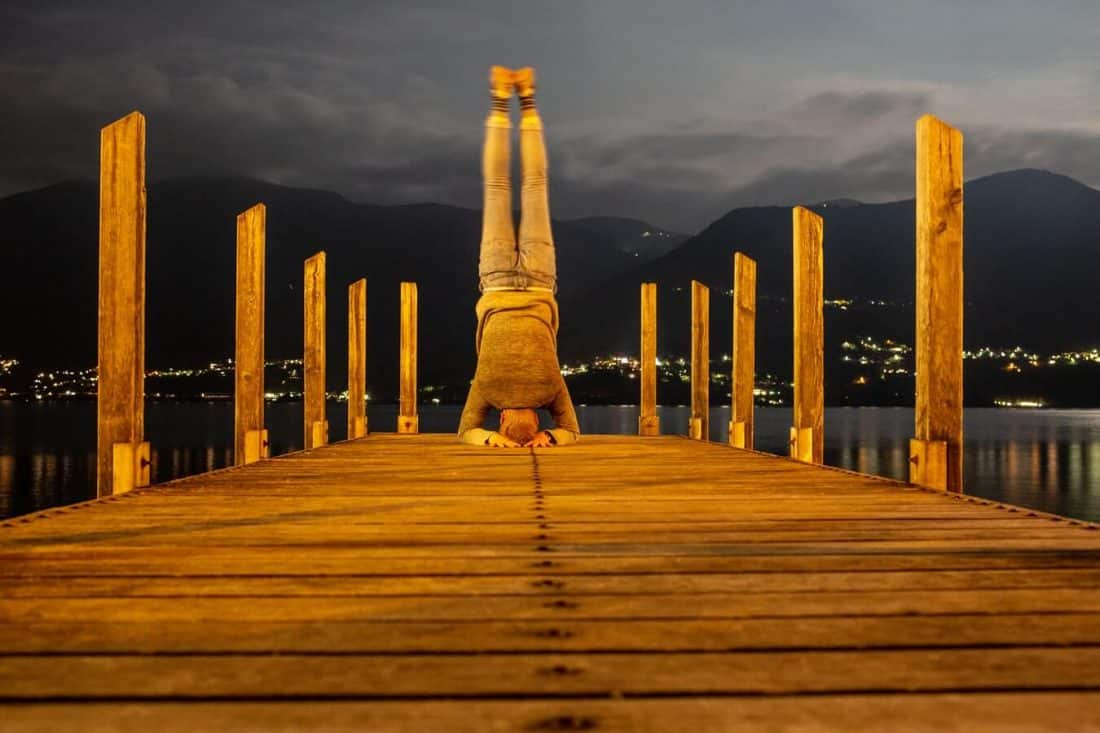 Man Doing Yoga at the end of a dock