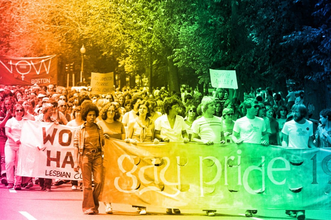 picture of pride march with rainbow effect over image