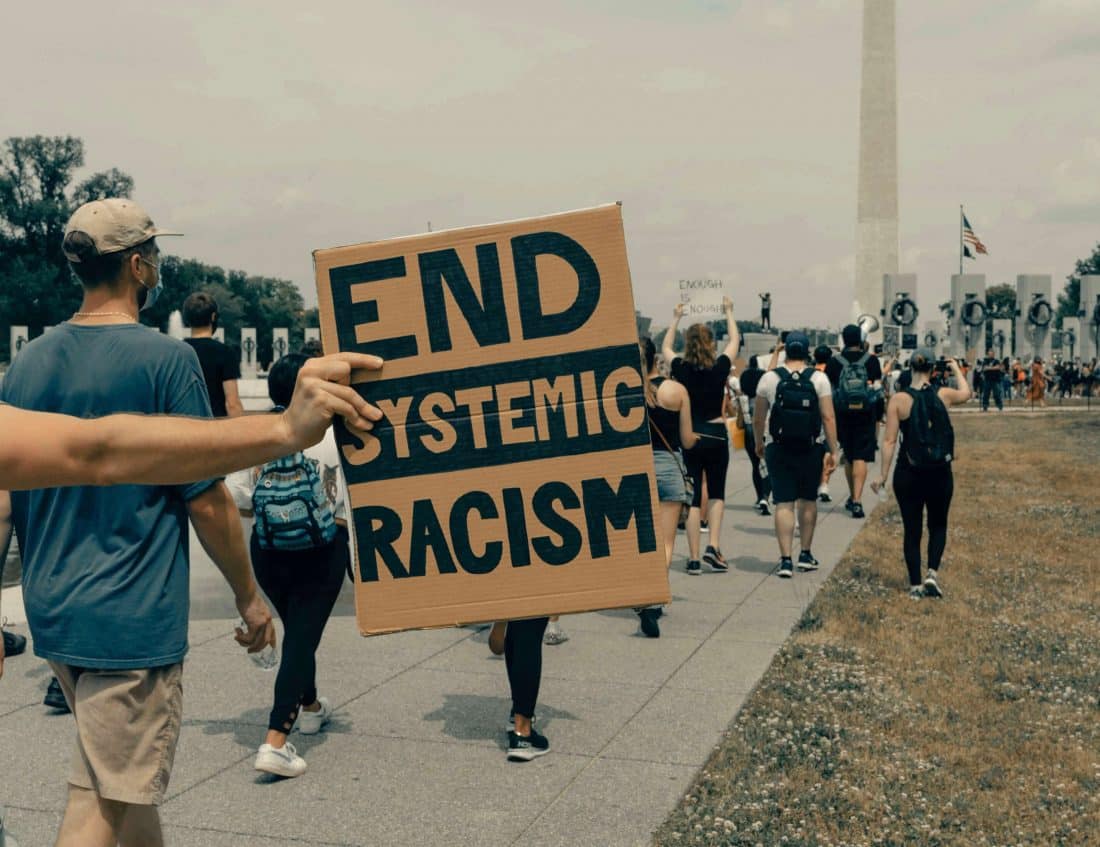 End Systemic Racism sign for march in washington, dc
